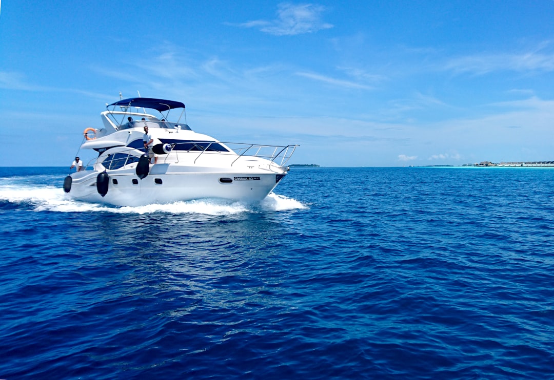 white-and-blue-yacht-on-sea-under-blue-sky-during-daytime-86wr5gzjzdq
